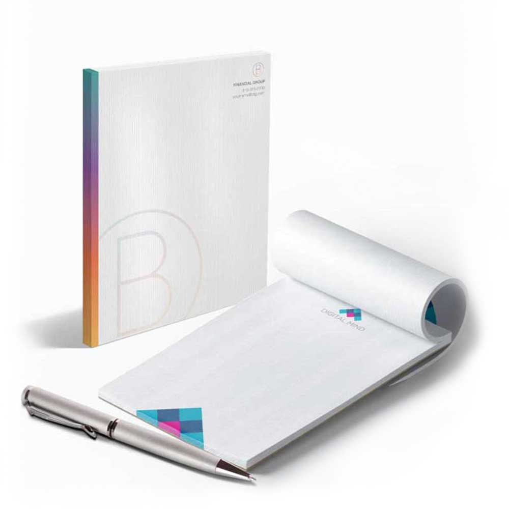 Two examples of white stationary with rainbow embellishments and a silver, metallic pen.