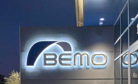 External signage with backlit logo and text "BEMO".