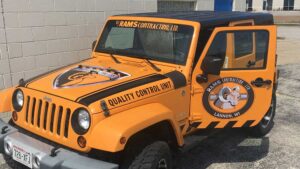 A jeep displaying custom wraps and graphics.